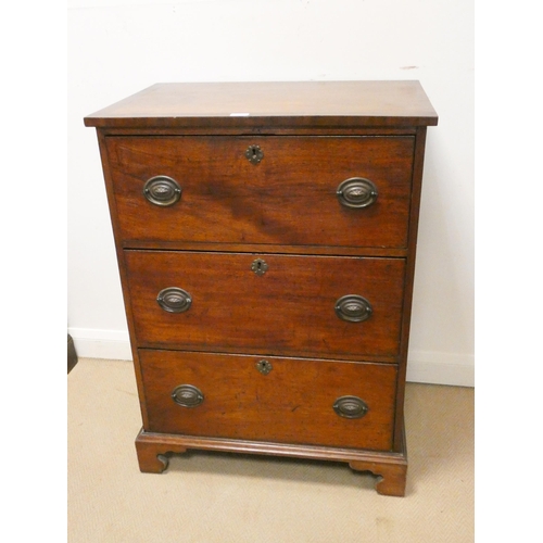 178 - A late Georgian mahogany secretaire chest of three drawers with cross banded top standing on bracket... 