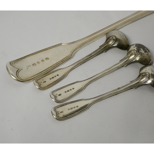 729 - A Victorian silver fiddle pattern basting spoon,  and three matching silver gilt mustard spoons Lond... 