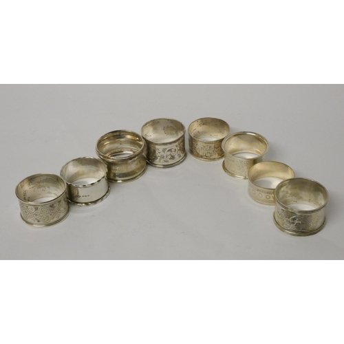 732 - A collection of eight various antique silver napkin rings. 5.3 troy ounces