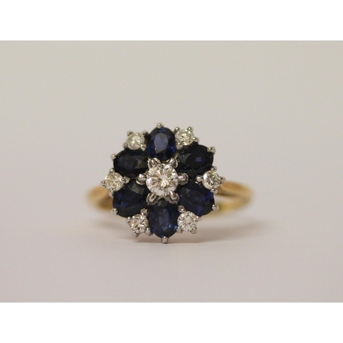 738 - An 18ct gold diamond & sapphire circular cluster ring set with seven Brilliant Cut Diamonds & Six ov... 