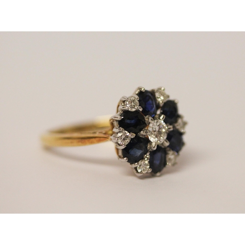 738 - An 18ct gold diamond & sapphire circular cluster ring set with seven Brilliant Cut Diamonds & Six ov... 