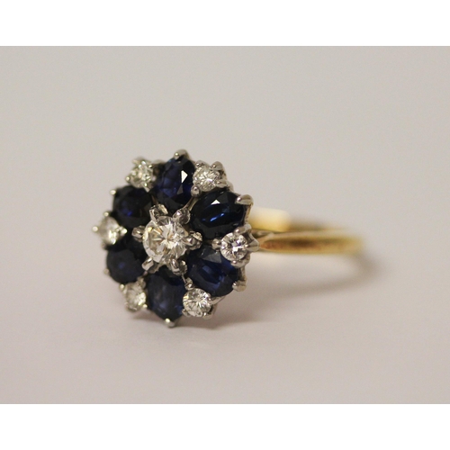 738 - An 18ct gold diamond & sapphire circular cluster ring set with seven Brilliant Cut Diamonds & Six ov... 