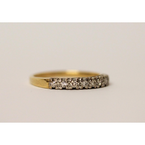 741 - An 18ct yellow gold half hoop eternity ring set with eight brilliant cut diamonds. Ring size P, Weig... 