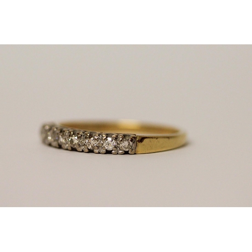 741 - An 18ct yellow gold half hoop eternity ring set with eight brilliant cut diamonds. Ring size P, Weig... 