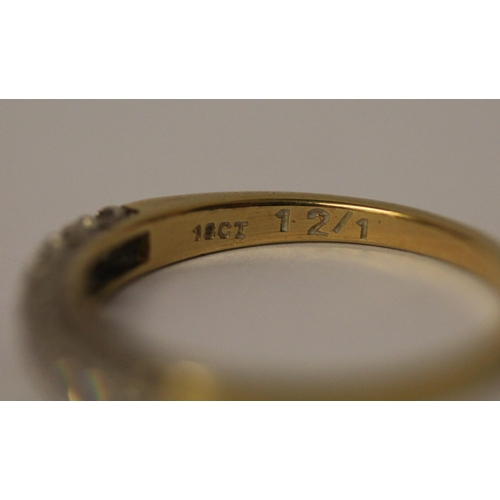 741 - An 18ct yellow gold half hoop eternity ring set with eight brilliant cut diamonds. Ring size P, Weig... 