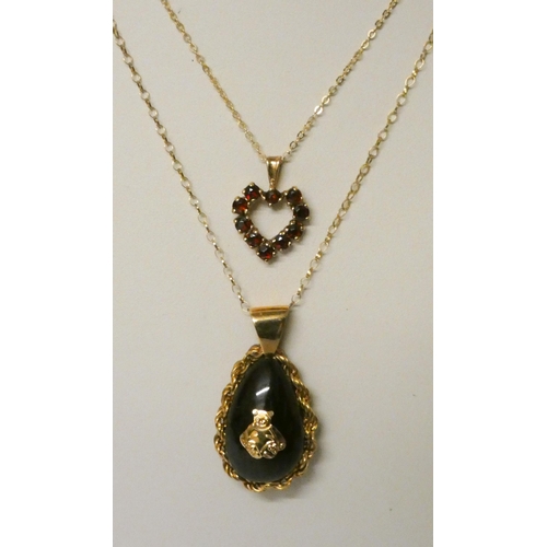 747 - 9ct gold garnet set heart pendant on fine 9ct gold chain and a tear drop shaped jet pendant with ted... 