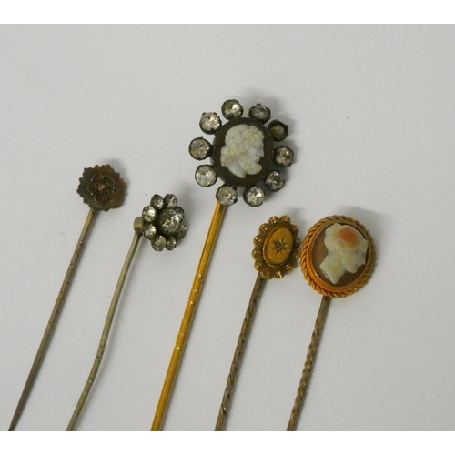 751 - Two antique cameo set stickpins, the classical lady's head marked 15ct, both cased, two 15ct gold st... 