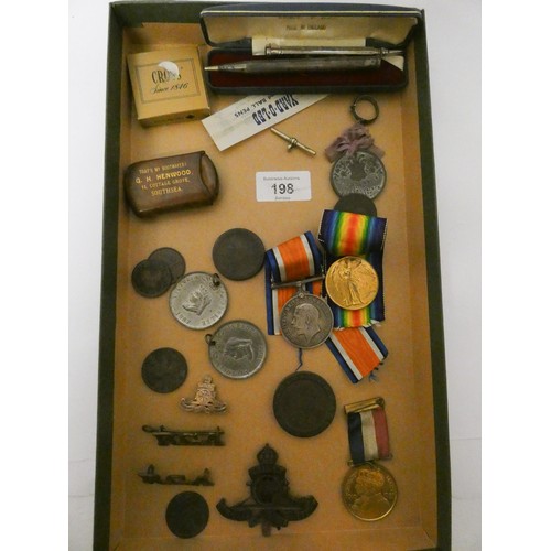 198 - A First World War pair of medals together with a Royal Artillery cap badge, coins, pens, ring, prope... 