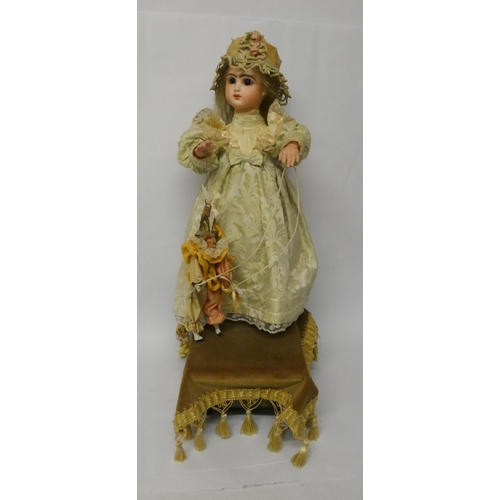 457 - A French musical  Automaton by Leopold Lambert, c. 1895 With Jumeau bisque character head stamped in... 