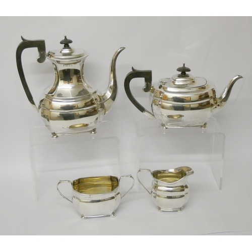 735 - A four piece hallmarked silver tea and coffee service, with ebony handles, hallmarked London 1957, g... 