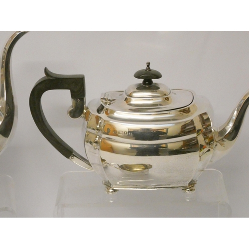 735 - A four piece hallmarked silver tea and coffee service, with ebony handles, hallmarked London 1957, g... 