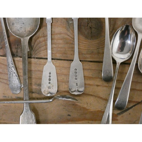 722 - A large collection of Georgian and later spoons, sauce ladle, silver pepper pot, silver handled tea ... 