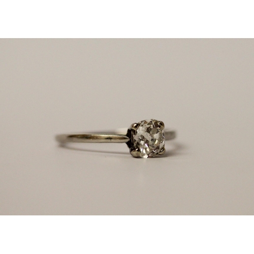 763 - A solitaire diamond ring, set with an old cut oval diamond weighing 0.80 carats, in platinum claw se... 