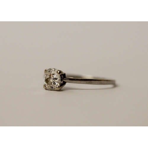 763 - A solitaire diamond ring, set with an old cut oval diamond weighing 0.80 carats, in platinum claw se... 