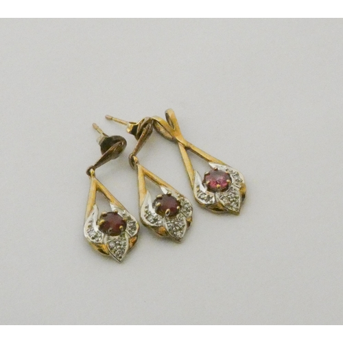 769 - A modern ruby and diamond pendant with matching drop earrings, in 9ct yellow gold