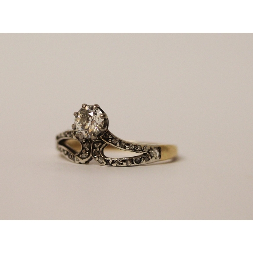 770 - An Edwardian diamond ring, the principal old cut diamond weighing 0.55 carats, on rose cut diamond m... 