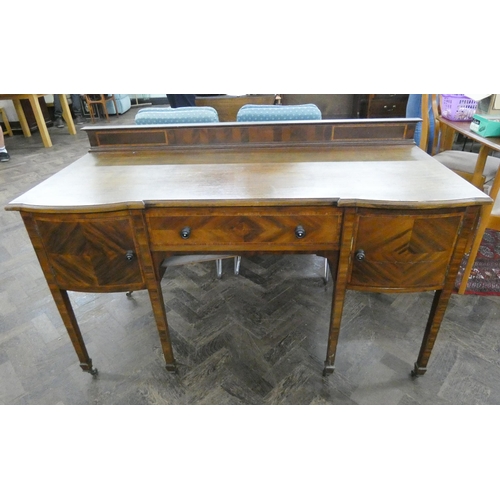 130 - An Edwardian inlaid mahogany kneehole sideboard or desk fitted drawer and cupboards