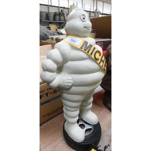 306 - A 44cm high Michelin man figurines standing on a tyre