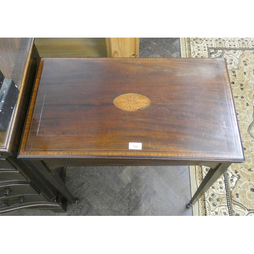 106 - An Edwardian star inlaid mahogany fold over top card table with green baize lining