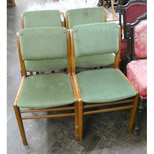 107 - A set of four retro teak dining chairs with green upholstery