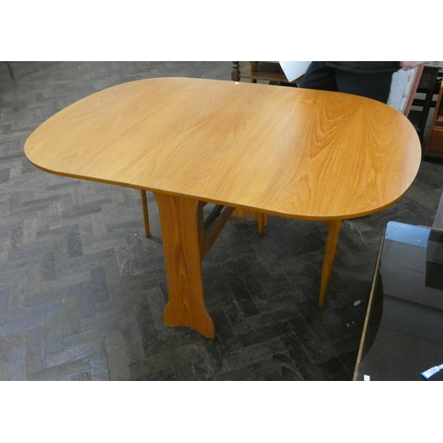 112 - A teak Sutherland style drop leaf dining table