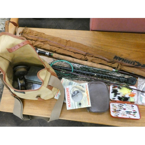 120 - A collection of vintage fishing tackle to include fly lines, landing net, rods etc