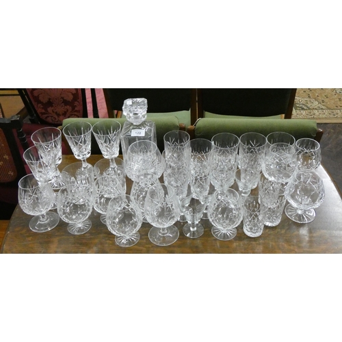 122 - A collection of cut glass brandy balloons, drinking glasses, tumblers and decanter