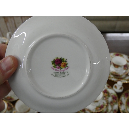 125 - A Royal Albert Old Country Roses dinner service, place setting for six, coffee and tea service