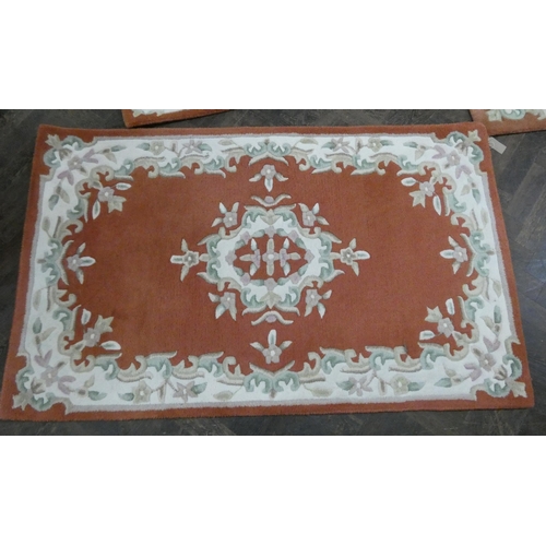 126 - A collection of four matching cut Chinese carpets of graduated size, the largest approx 6' x 4'