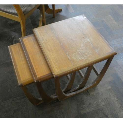 141 - A nest of three GPlan teak coffee tables and a further teak rectangular coffee table