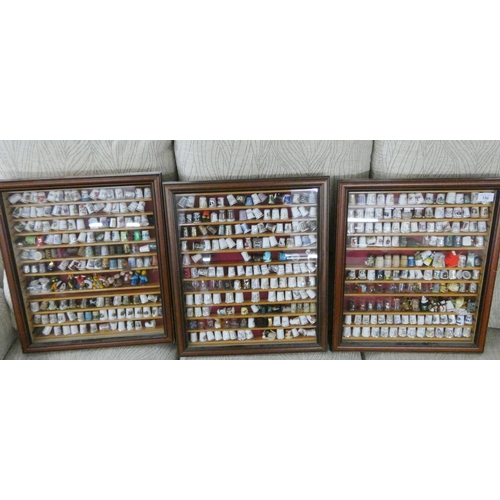 156 - Three modern wall mounting glazed display cases of collectable bone china and other thimbles