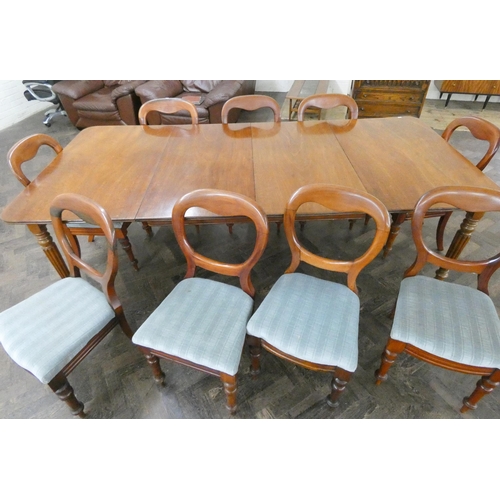 168 - A Victorian mahogany dining table with two centre leaves standing on reeded legs, together with nine... 