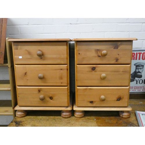 170 - A pair of pine three drawer bedside chests