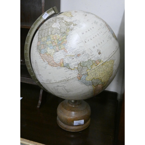 19 - A large globe of the world on a turned oak base