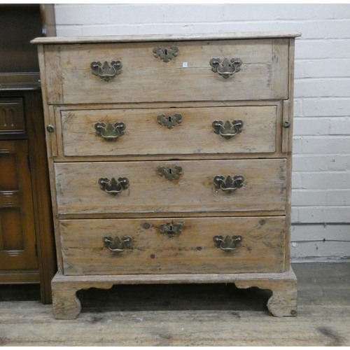 32 - An antique stripped pine secretaire chest fitted four long drawers, the top with fitted interior and... 