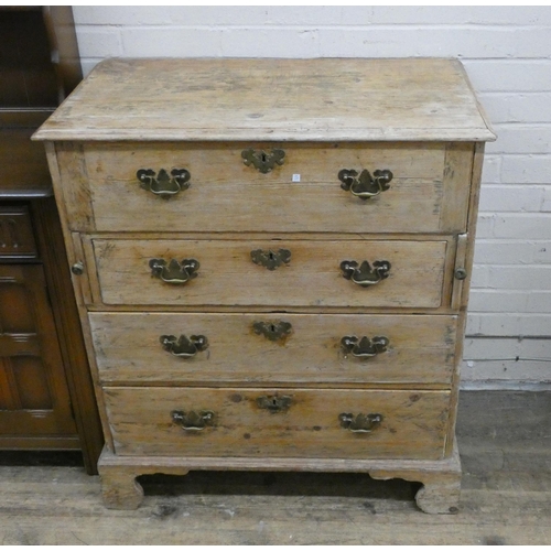 32 - An antique stripped pine secretaire chest fitted four long drawers, the top with fitted interior and... 