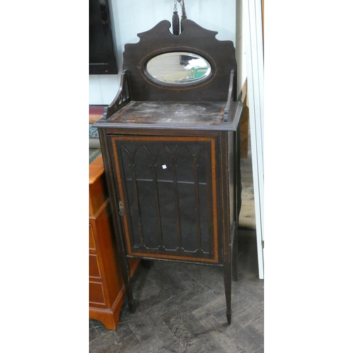 41 - An Edwardian inlaid mahogany music cabinet with shelf mirrored back