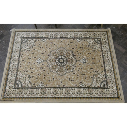 51 - A small cream and beige figured Persian design rug approximately 5' x 4'