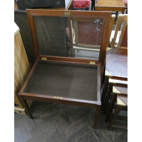 54 - A mahogany framed glazed top bijouterie table