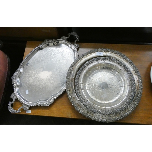 59 - Two ornate silver plated salver style dishes and a silver plated twin handled tray