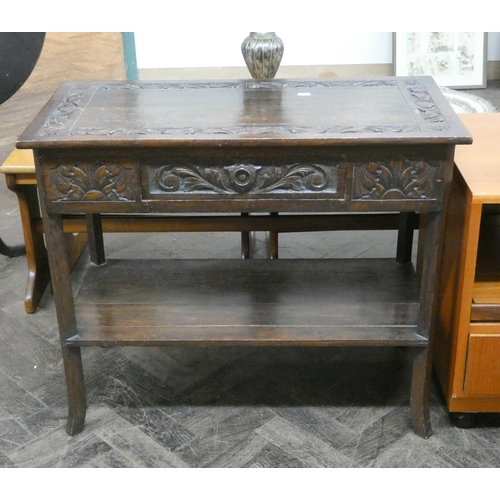 99 - Late Victorian carved oak hall table, fitted one drawer with an open under tier