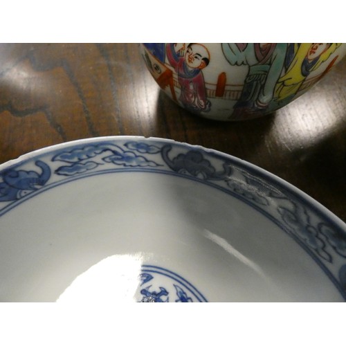 193 - Chinese blue and white circular bowl decorated with a dragon chasing a pearl, four character mark on... 