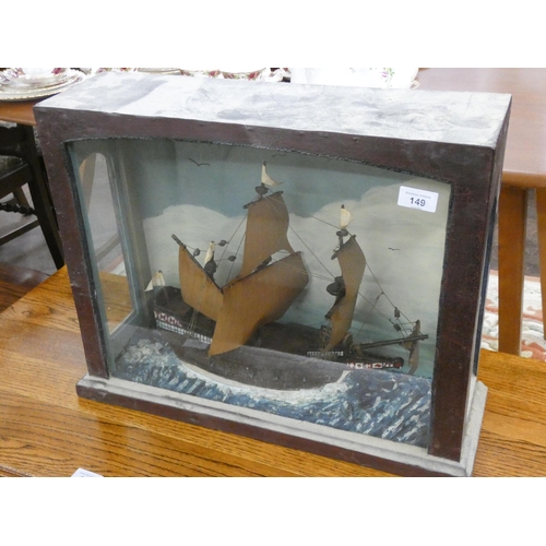 149 - A model of an old sailing ship in glazed case