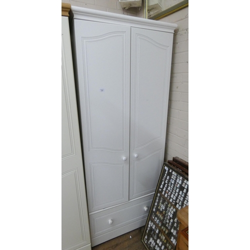 174 - A modern white two door wardrobe with drawer under, 2'6 wide