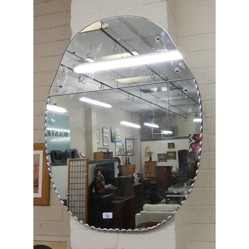 175 - An oval decorative shaped wall mirror