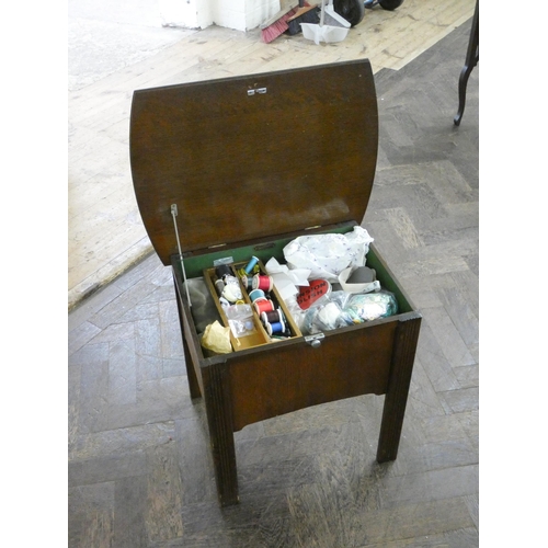 194 - A two tier drop leaf tea trolley together with an oak workbox with assorted cottons etc