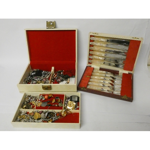 72 - A jewellery box and contents and some cased fish knives and forks with mother of pearl handles