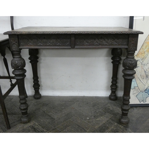 201 - A Victorian carved oak hall table fitted two drawers on carved bulbous legs, 3' wide