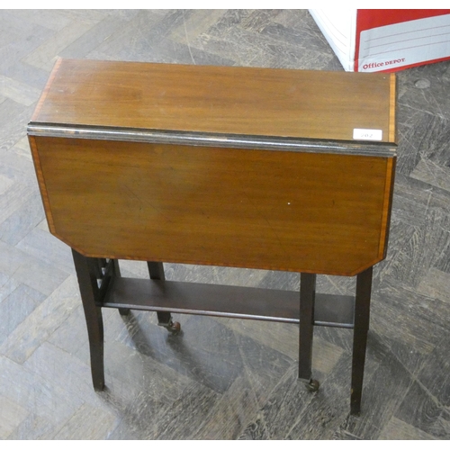 202 - An Edwardian inlaid mahogany Sutherland table, 20