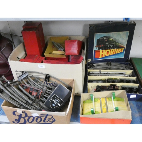 269 - A large quantity of boxed vintage  Hornby Railway trains, carriages, accessories etc and a box of tr... 